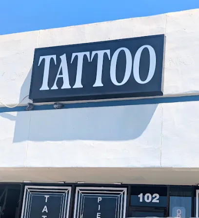 Golden Cobra Tattoos and Piercings
